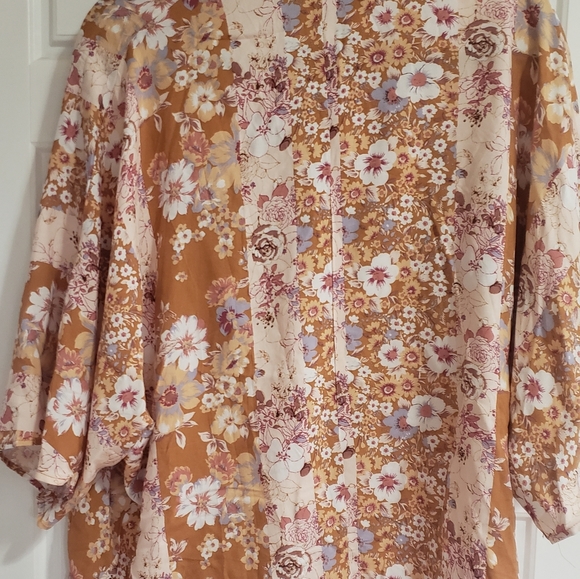 Boho floral top. Bell sleeves, crossover front, cool and breezy. - Picture 2 of 5